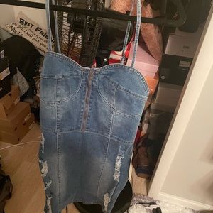 Women’s size medium stretch mini denim dress. Never worn, tags still on. TTS